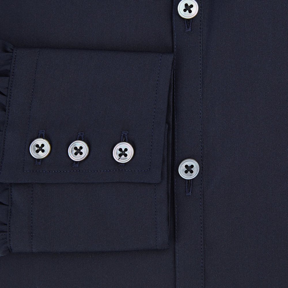 The Navy Westminster Shirt by Turnbull & Asser is a classic long-sleeve, button-up shirt with a pointed collar and buttoned cuffs, exemplifying British craftsmanship, shown against a plain white background.