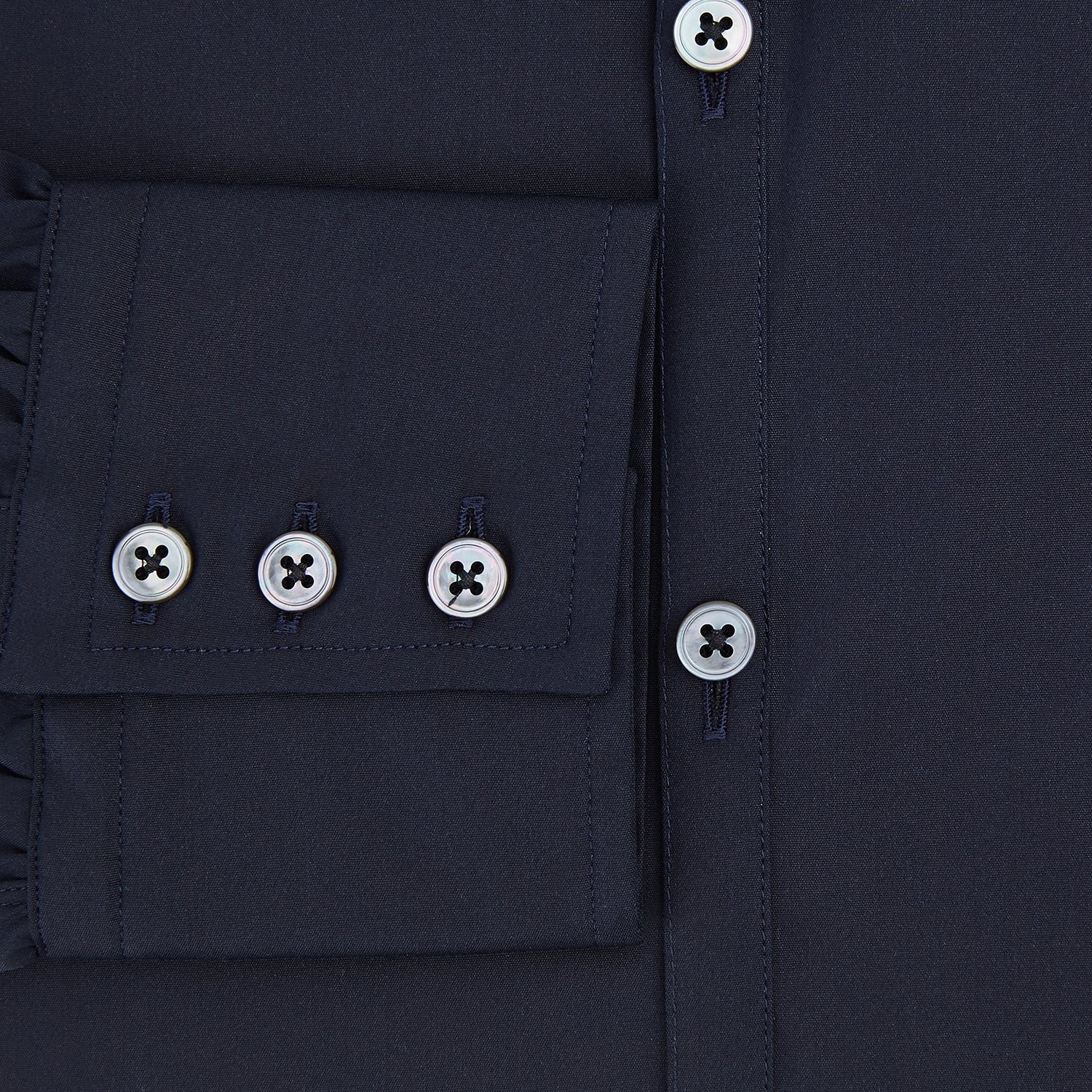 View 4 of product The Navy Westminster Shirt by Turnbull & Asser is a classic long-sleeve, button-up shirt with a pointed collar and buttoned cuffs, exemplifying British craftsmanship, shown against a plain white background.