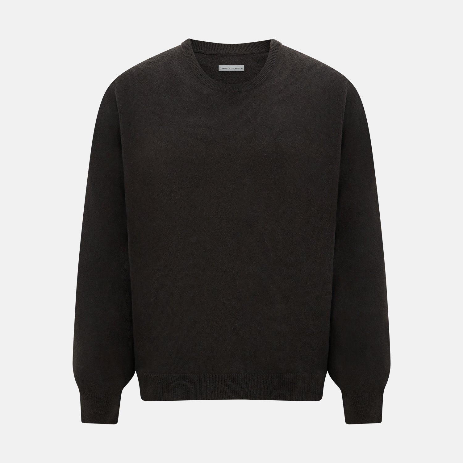 View 1 of product A plain, long-sleeved brown cashmere round neck jumper by Turnbull & Asser displayed on a white background. This men’s knitwear features ribbed cuffs, hem, and neckline with a relaxed fit and no visible patterns or logos.