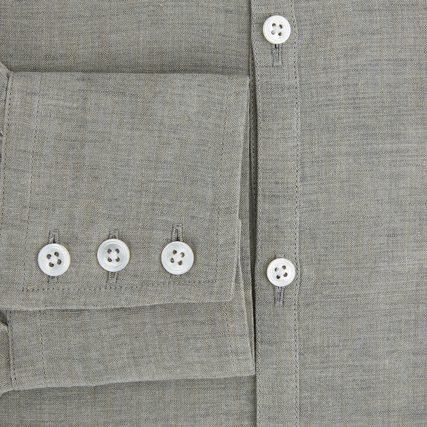 View 4 of product The Flint Grey Linen Westminster Shirt by Turnbull & Asser features long sleeves, a pointed Westminster collar, white buttons, and fine British craftsmanship, shown on a plain white background.