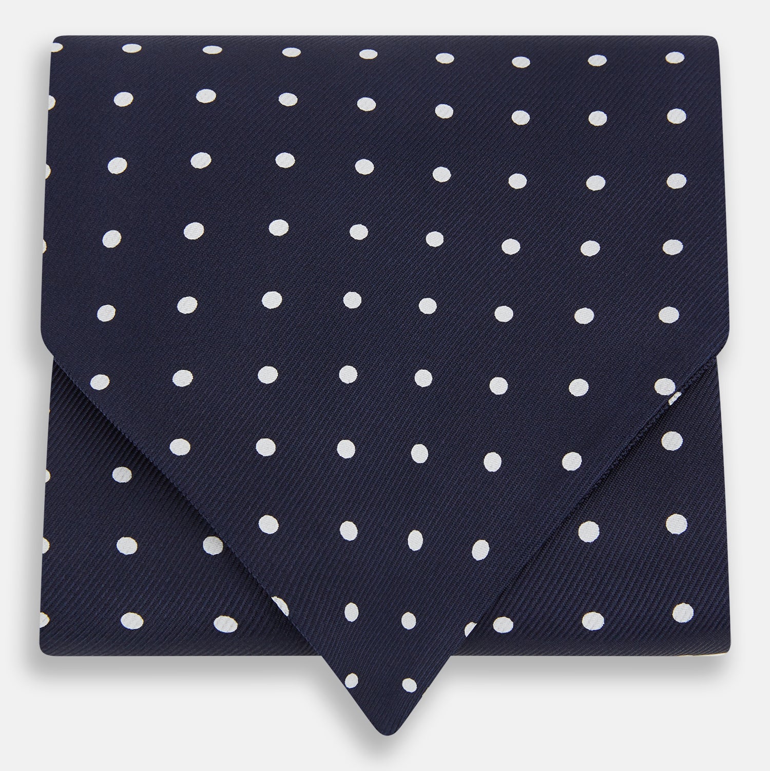 View 1 of product The White Dot and Navy Silk Cravat by Turnbull & Asser features evenly spaced white polka dots on navy silk—a classic accessory ideal for adding British elegance to any look.