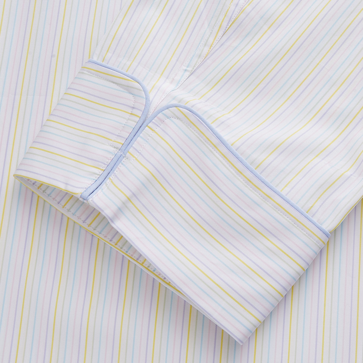 View 2 of product The Yellow Multi Stripe Cotton Quin Pyjama Set by Turnbull & Asser features a striped button-up top with chest pocket and drawstring pants—luxury sleepwear crafted from soft cotton, displayed on a white background.
