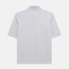 View 3 of product A soft pink cotton polo shirt by Turnbull & Asser features short sleeves, a contrasting white collar, three dark buttons, and a left chest pocket. Laid flat on a white background—it’s perfect for modern men’s fashion.