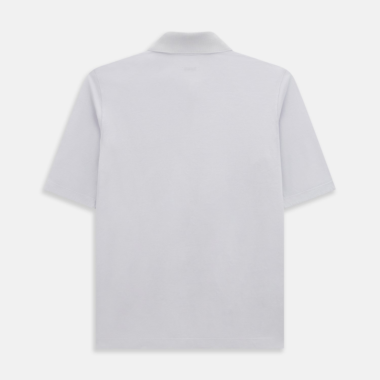View 3 of product A soft pink cotton polo shirt by Turnbull & Asser features short sleeves, a contrasting white collar, three dark buttons, and a left chest pocket. Laid flat on a white background—it’s perfect for modern men’s fashion.