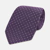 View 1 of product The Turnbull & Asser Lavender and Purple Micro Dot Silk Tie is displayed rolled-up against a plain white background.