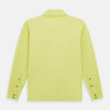 View 3 of product The Turnbull & Asser Lime Green Rugby Polo Shirt is a pure cotton, long-sleeve shirt with a collar and no visible buttons, displayed flat against a white background.