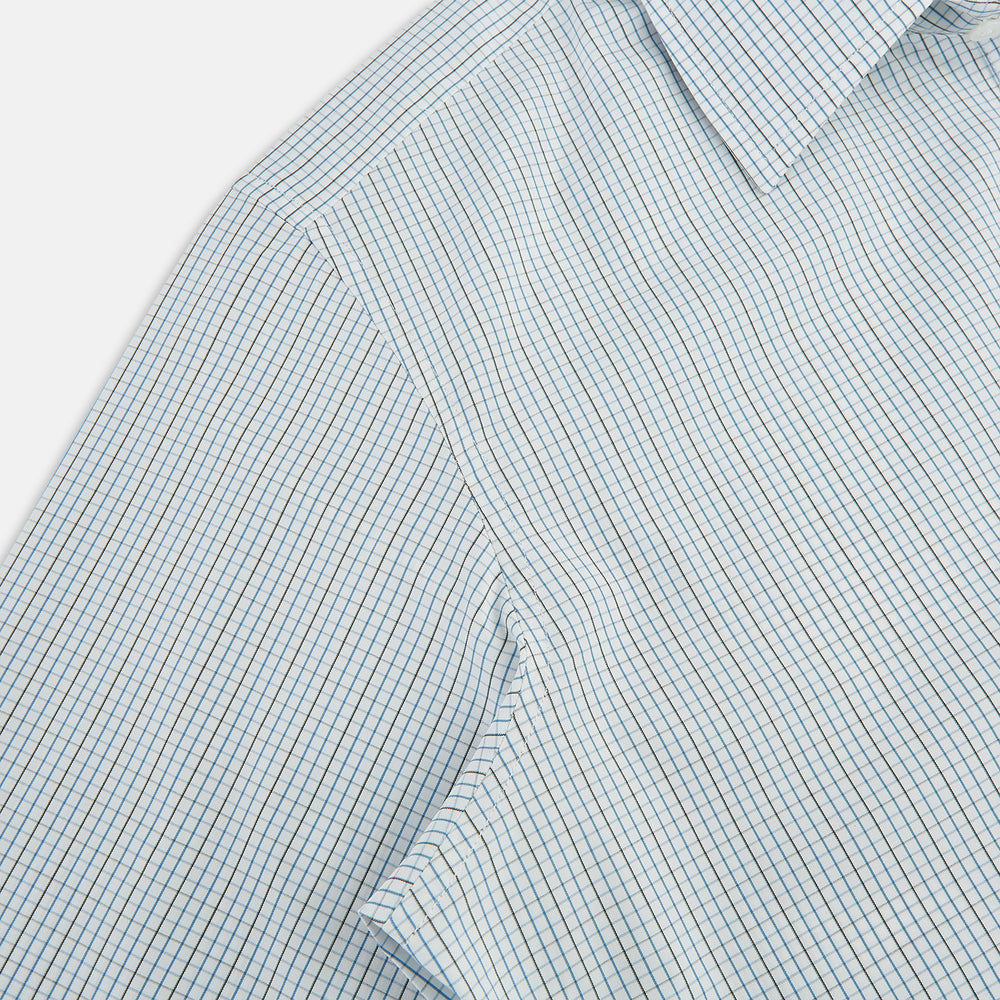 The Pale Blue and Navy Grid Check Westminster Shirt by Turnbull & Asser features a button-down front and pointed collar, highlighting fine British craftsmanship, displayed on a white background.