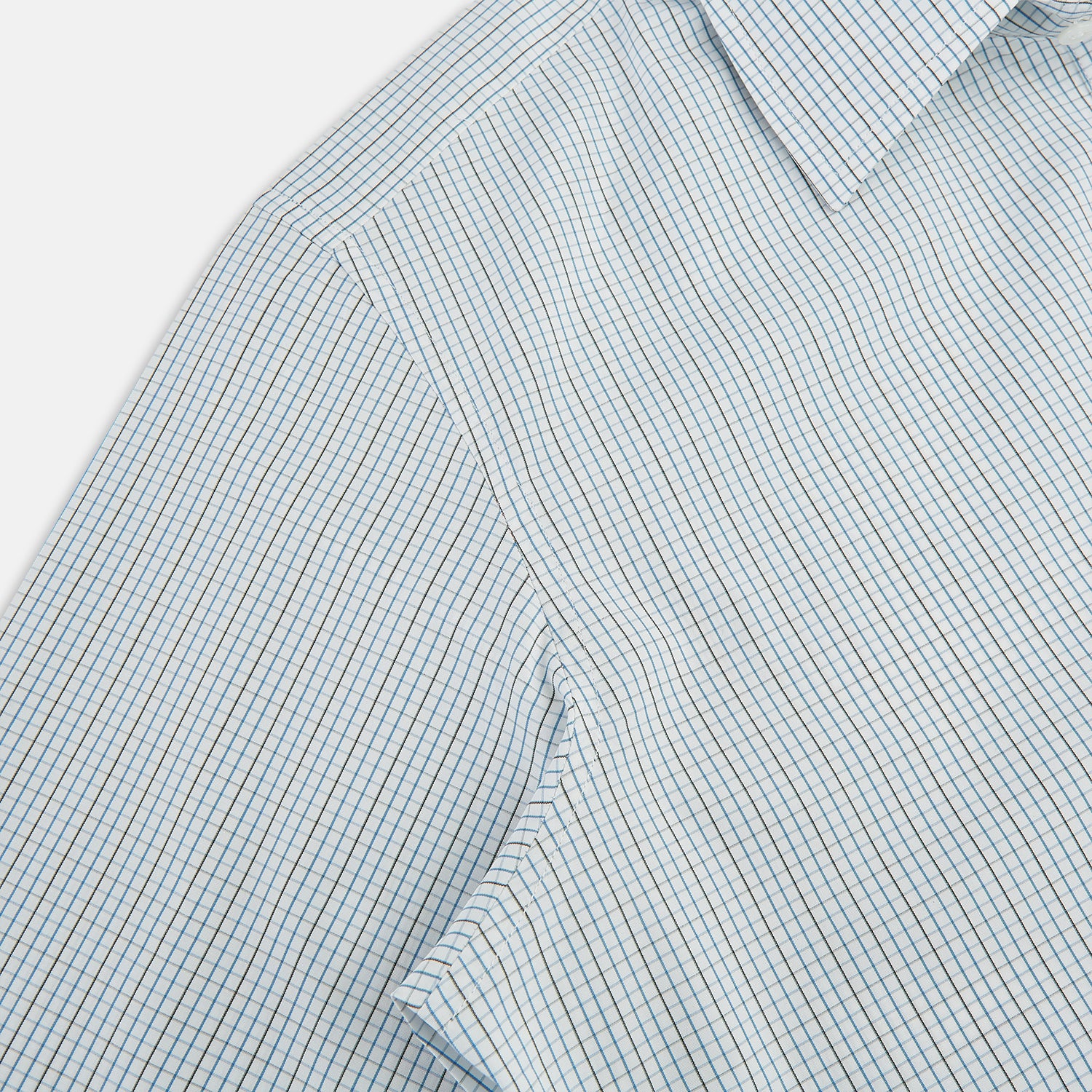 View 6 of product The Pale Blue and Navy Grid Check Westminster Shirt by Turnbull & Asser features a button-down front and pointed collar, highlighting fine British craftsmanship, displayed on a white background.
