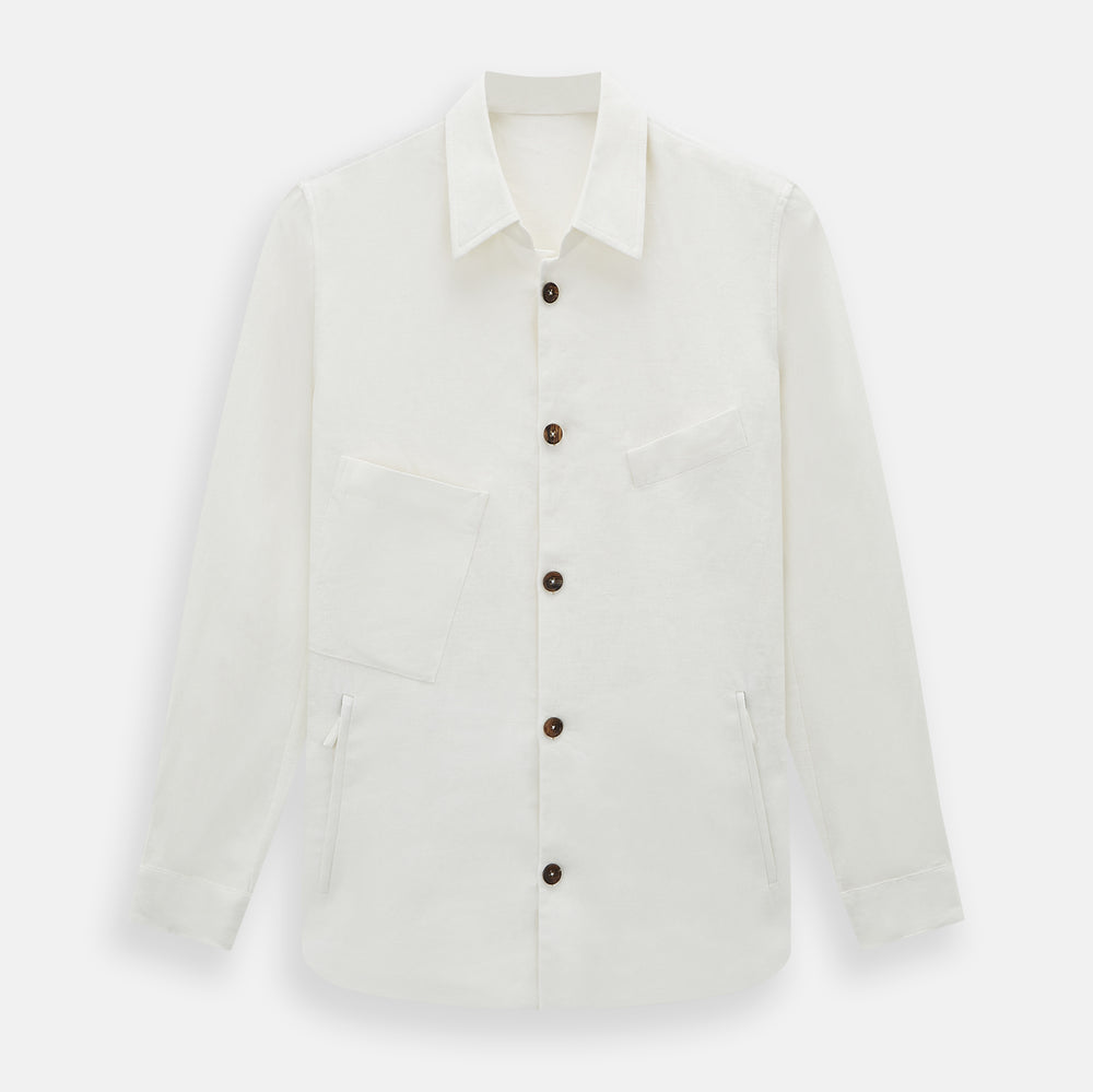 The Vanilla Linen Holland Shacket by Turnbull & Asser, a white Irish linen button-up with a collar, brown buttons, and four pockets, is laid flat on a white background—perfect as lightweight outerwear.