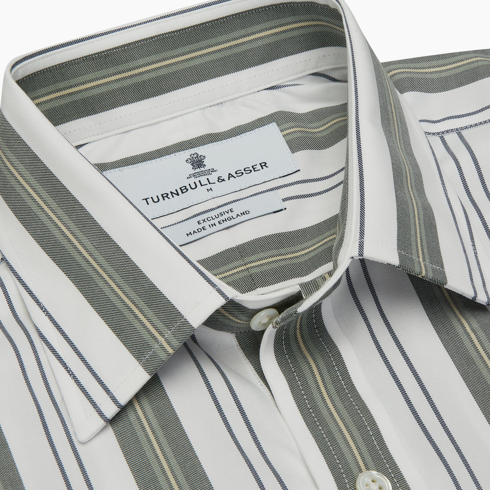 The Turnbull & Asser Green, Blue & White Stripe Weekend Fit Shirt features a Derby collar, 1-button cuffs, and chest pocket—ideal for stylish winter layering and classic sophistication.