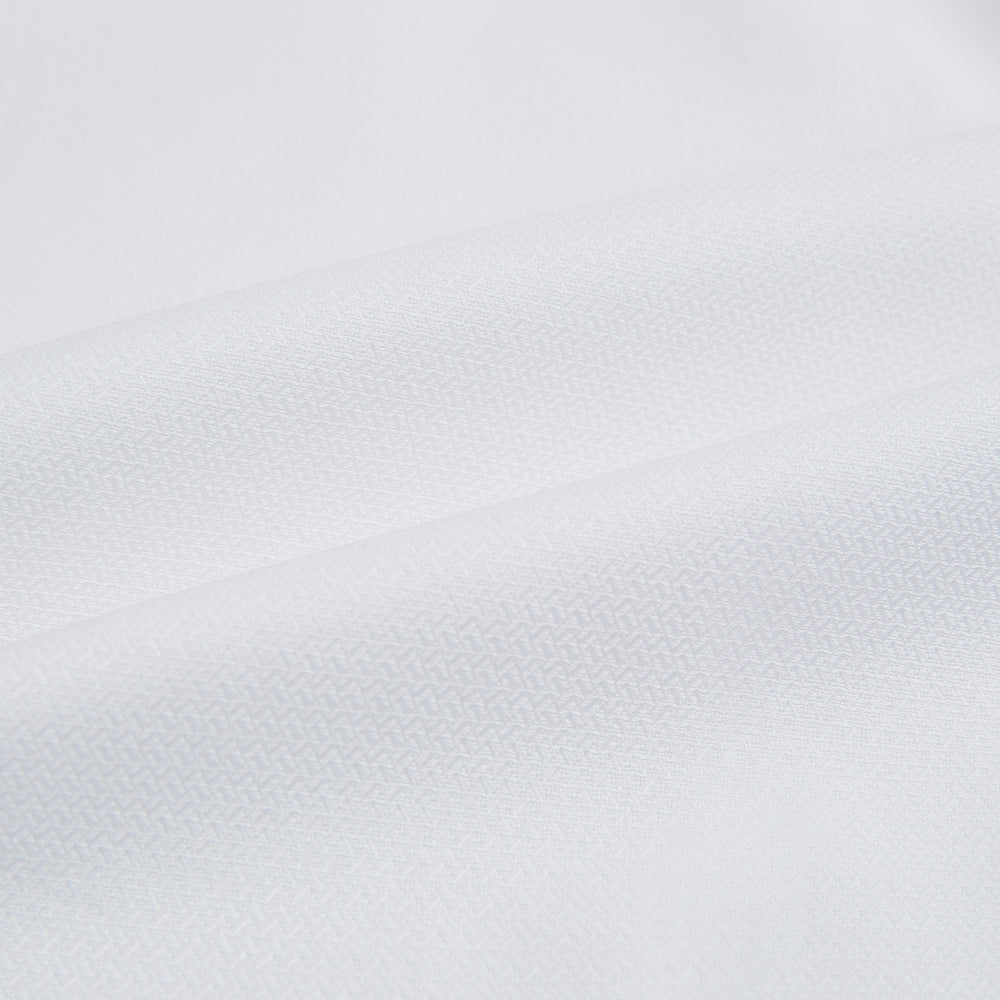 The Turnbull & Asser White Herringbone Mayfair Shirt features long sleeves and a classic collar—a timeless wardrobe essential, shown here against a white background.