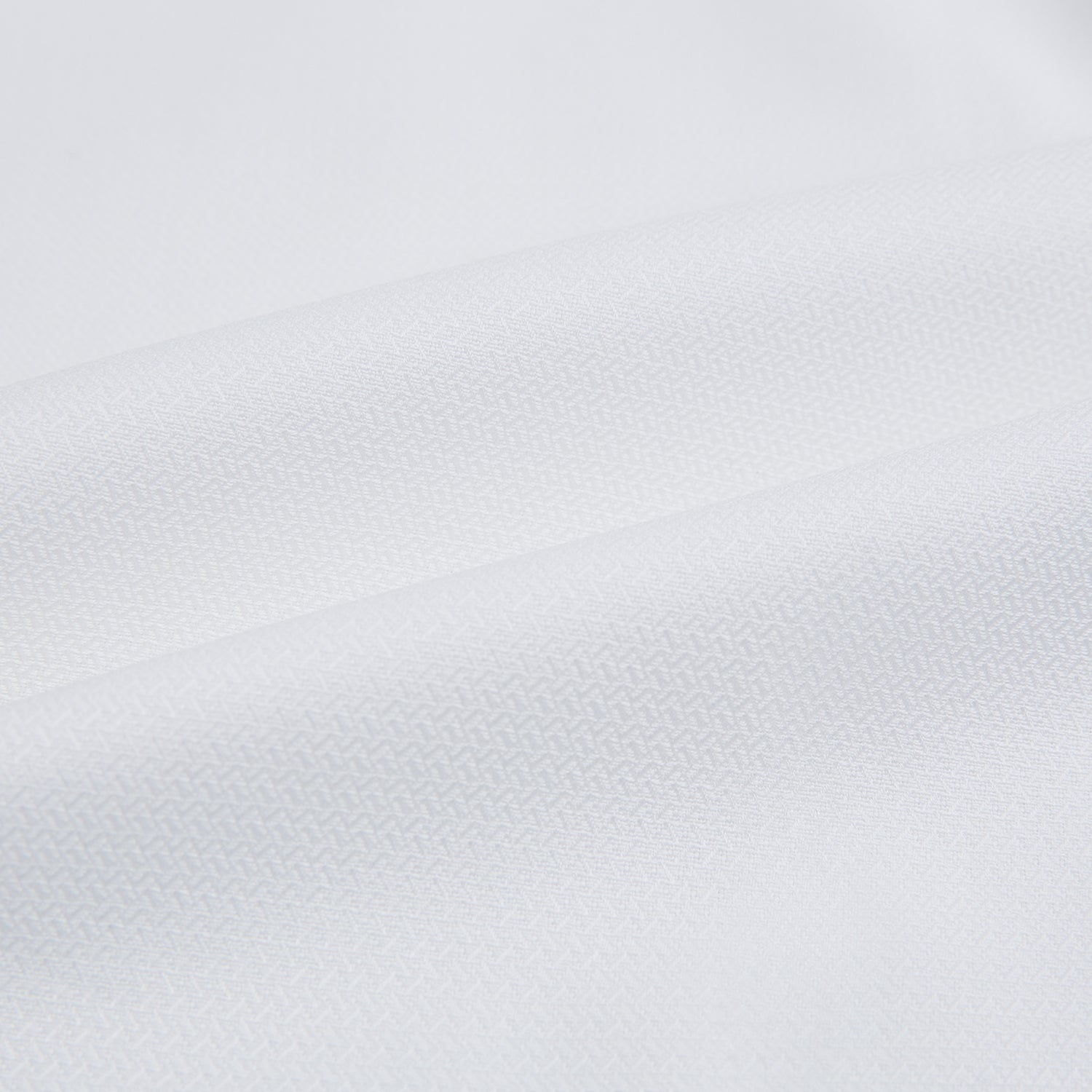 View 6 of product The Turnbull & Asser White Herringbone Mayfair Shirt features long sleeves and a classic collar—a timeless wardrobe essential, shown here against a white background.