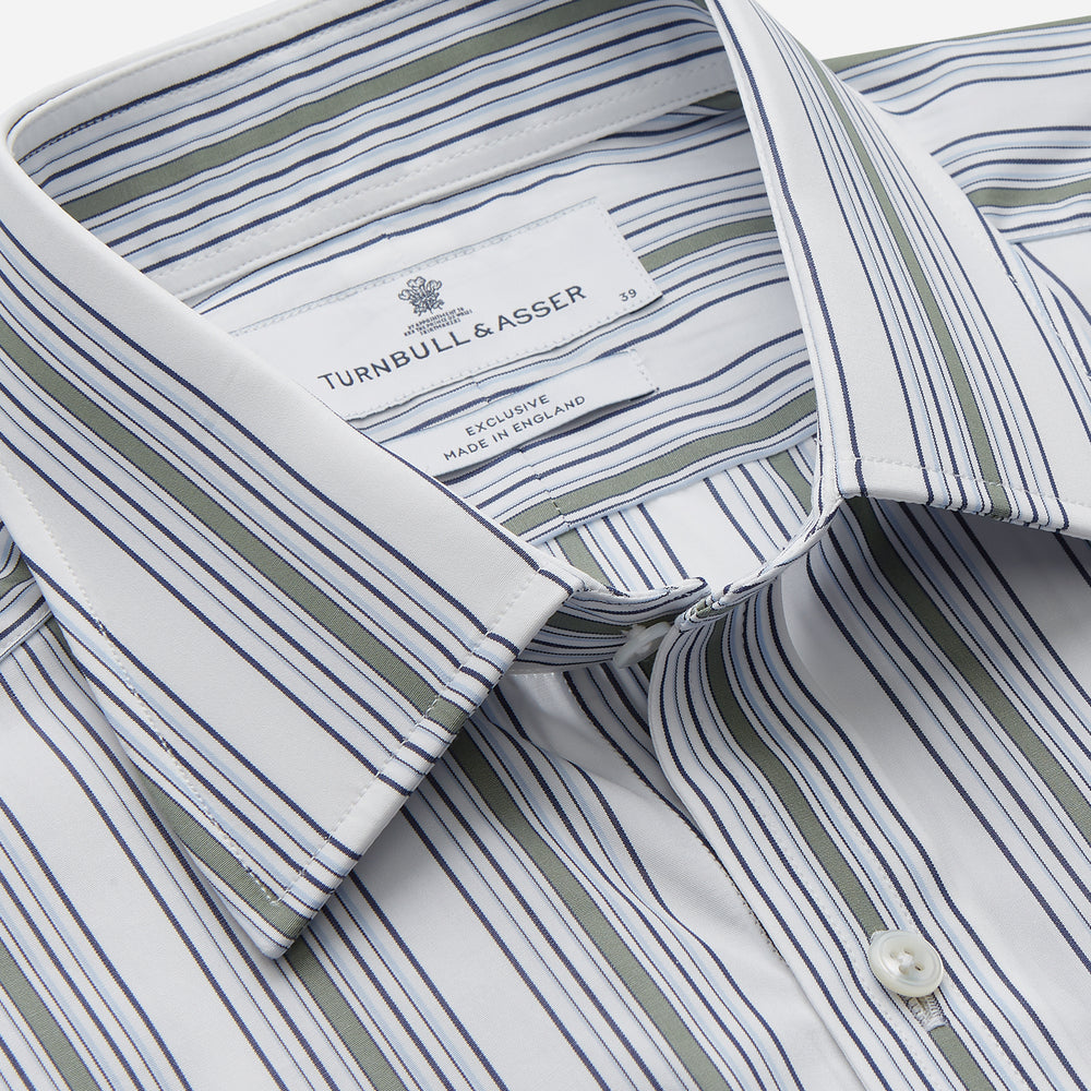 The Turnbull & Asser Green Multi Stripe Regular Fit Shirt features a T&A collar, 3 button cuffs, long sleeves, and vertical blue, green, and white stripes. Laid flat on a white background.
