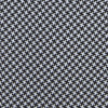 View 3 of product The Turnbull & Asser White and Black Houndstooth Woven Silk Tie, shown rolled on a light grey background, adds a classic touch to any smart outfit.