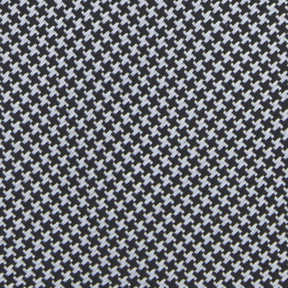 The Turnbull & Asser White and Black Houndstooth Woven Silk Tie, shown rolled on a light grey background, adds a classic touch to any smart outfit.