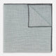 A neatly folded green cotton-blend Turnbull & Asser handkerchief with visible hand-rolled edges and one corner flipped over, showing the reverse side.