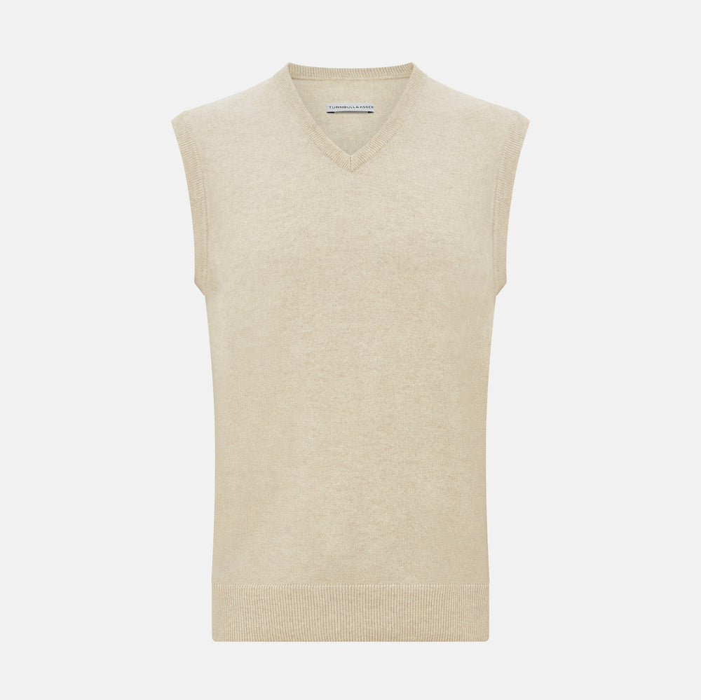The Turnbull & Asser Cream Cashmere V-neck Vest features a sleeveless design and ribbed hem, presented on a plain white background—a refined update to the classic men’s sweater.