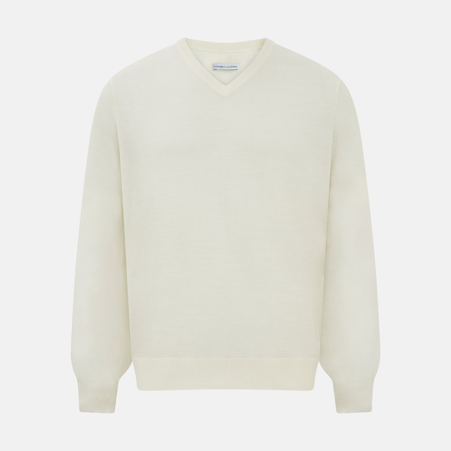 View 7 of product The Turnbull & Asser Cream Fine Merino V-Neck Jumper features long sleeves and classic styling, displayed against a white background.