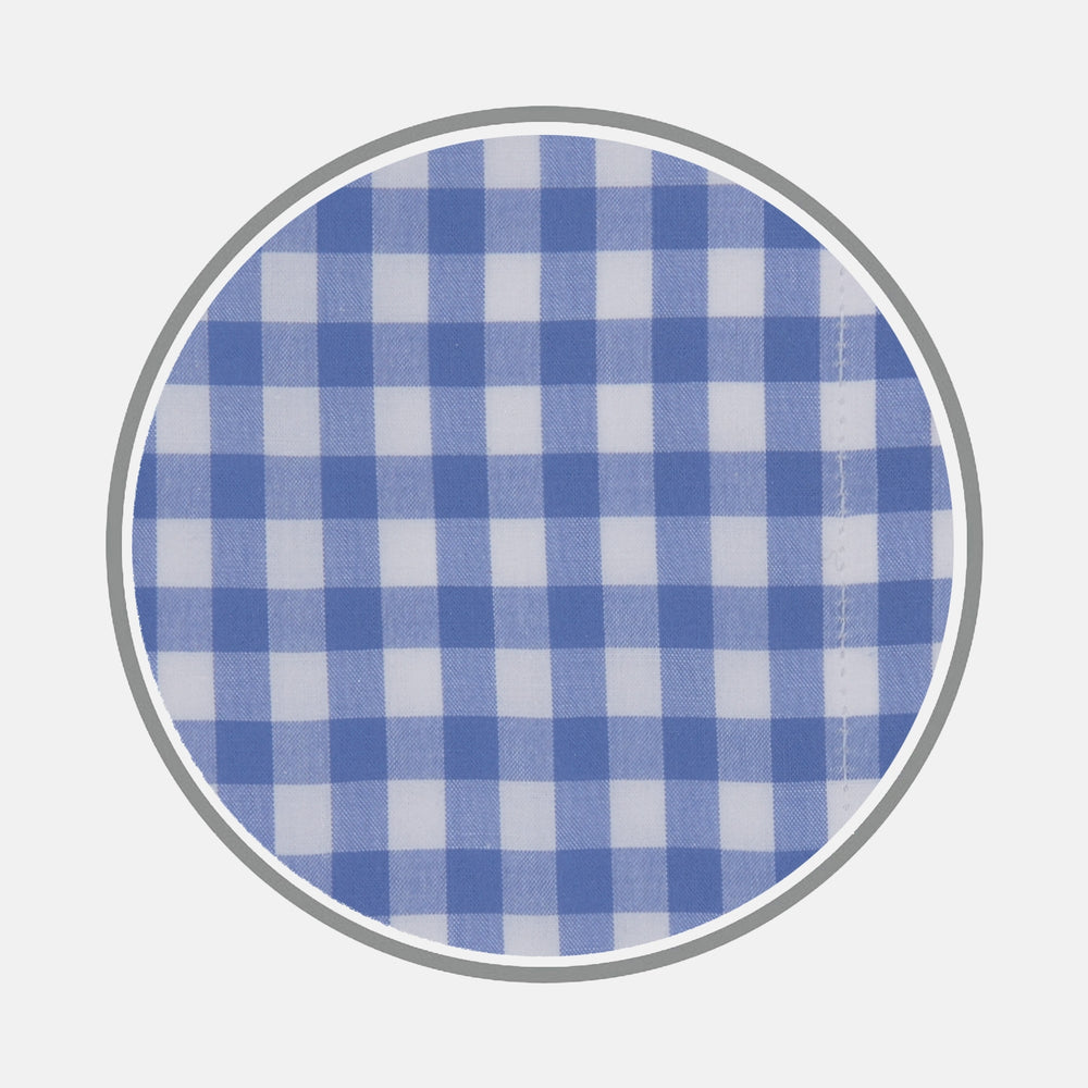 A close-up of Turnbull & Asser’s Blue Wide Gingham Check Cotton Fabric is shown inside a gray circular border on a plain white background.