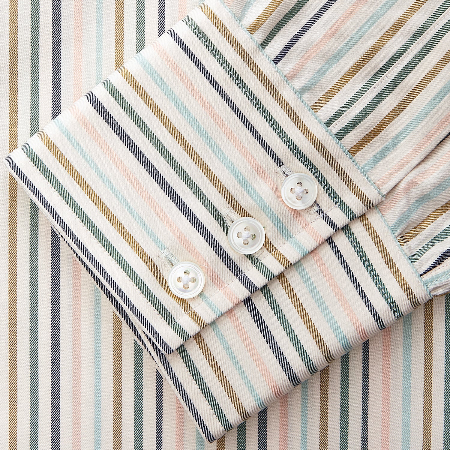 View 3 of product The Green Multi Stripe Regular Fit Shirt by Turnbull & Asser features a T&A collar, 3 button cuffs, and thin blue, green, yellow, and red stripes on white—adding a lively touch to any wardrobe.