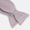 View 3 of product The Turnbull & Asser Pale Pink and White Square Silk Bow Tie features white stripes and subtle square patterns, ideal for formalwear. Shown on a white background.