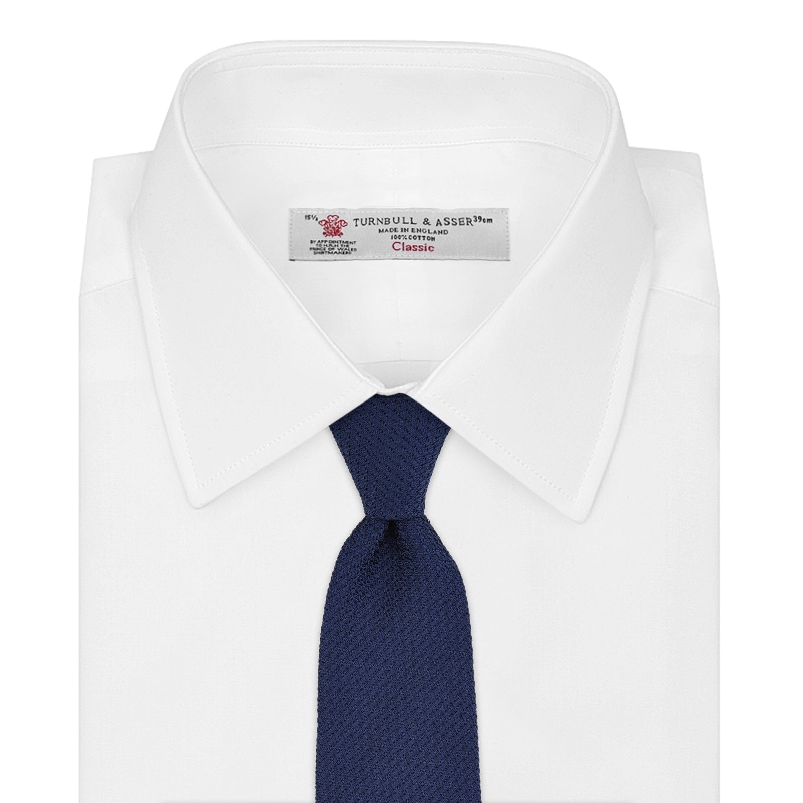 View 2 of product The Turnbull & Asser Plain Woven Grenadine Silk Tie in navy, with a textured finish, is rolled and displayed on a white background—a refined essential for any wardrobe.