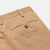 View 2 of product The Camel Front Pleated Manson Trouser by Turnbull & Asser, tailored in Italy with belt loops, front crease, side pockets, and a button closure, is shown laid flat on a white background.