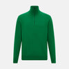 View 1 of product The Grass Green Half-Zip Cashmere Jumper by Turnbull & Asser is a long-sleeve knitwear pullover with a high collar and front half-zip closure, shown against a plain white background.