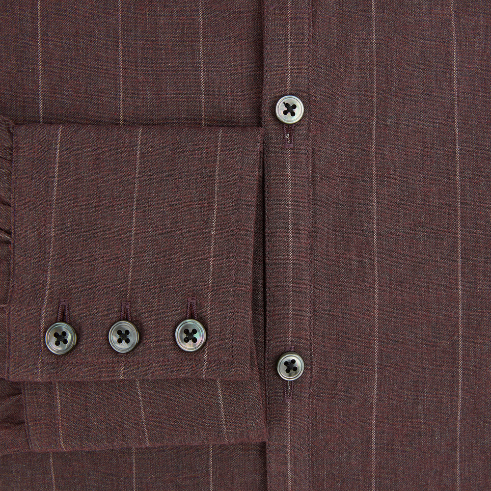 The Indies Red Wide Stripe Westminster Shirt by Turnbull & Asser features wide red stripes, a classic collar, and a tailored fit, reflecting British craftsmanship. Displayed against a white background.