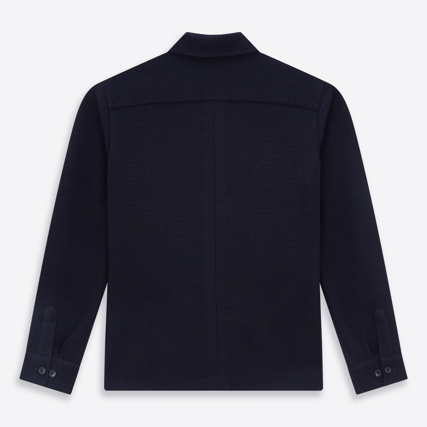 View 3 of product The Turnbull & Asser Navy Greenwich Knitted Overshirt, made from Italian wool with a collar, two front flap pockets, and a hidden button placket, is shown laid flat on a white background.