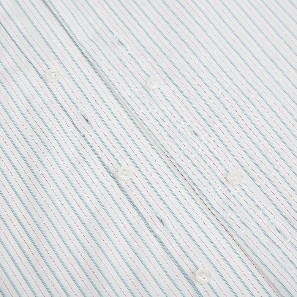 The Turnbull & Asser Turquoise and Red Multi Check Westminster shirt features long sleeves, a standard collar, and buttoned cuffs, showcasing fine British craftsmanship. It’s pictured laid flat on a white background.