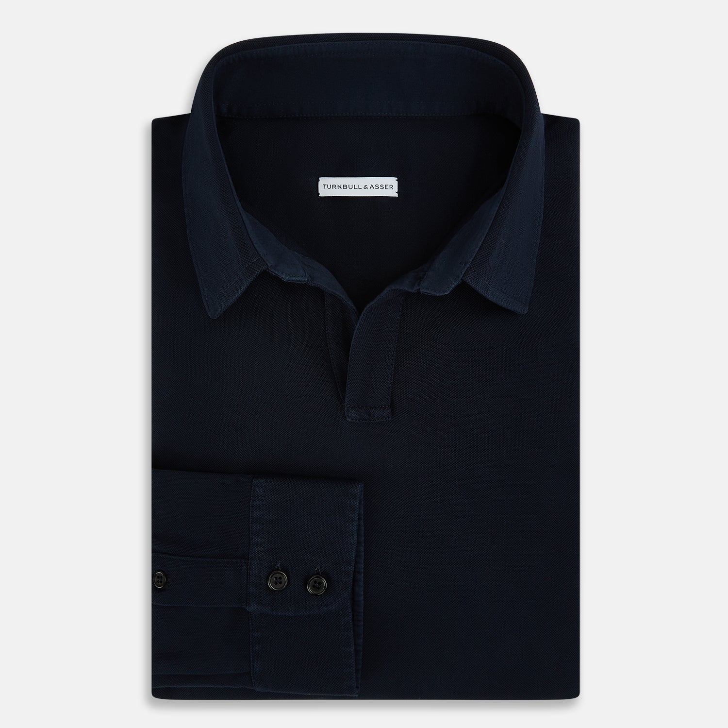 View 5 of product A Navy Rugby Polo Shirt by Turnbull & Asser, featuring long sleeves and a collar, is displayed flat on a white background. The design is simple and free of visible logos or patterns.