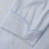 View 3 of product The Turnbull & Asser Blue and Yellow Check Poplin Cotton Dressing Gown features long sleeves, a shawl collar, front pockets, and a matching belt at the waist, shown on a plain white background.