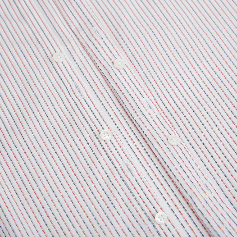 The Turnbull & Asser Red and Blue Double Stripe Westminster Shirt is a long-sleeved, button-up dress shirt with a formal collar, featuring narrow red and blue stripes on white, shown against a plain white background.
