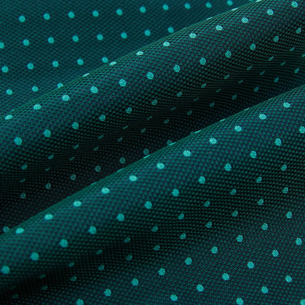 The Turnbull & Asser Turquoise and Forest Green Micro Dot Silk Cravat features a refined micro dot pattern, adding sophisticated style to formal looks. Displayed on a white background.