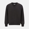 View 1 of product The Turnbull & Asser Charcoal Grey Fine Merino Round Neck Jumper for men features long sleeves, ribbed cuffs, hem, and collar. Displayed on a white background, this classic knitwear piece has a plain design with no visible logos or patterns.