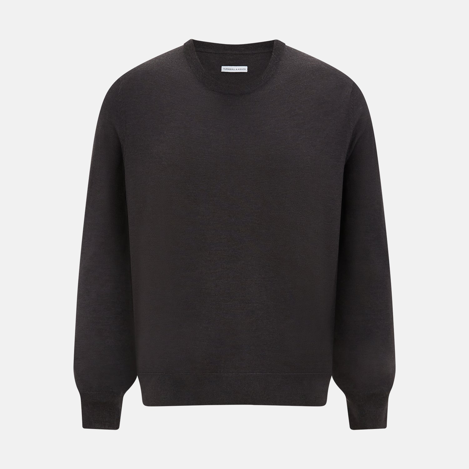 View 1 of product The Turnbull & Asser Charcoal Grey Fine Merino Round Neck Jumper for men features long sleeves, ribbed cuffs, hem, and collar. Displayed on a white background, this classic knitwear piece has a plain design with no visible logos or patterns.