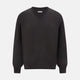 The Turnbull & Asser Charcoal Grey Fine Merino Round Neck Jumper for men features long sleeves, ribbed cuffs, hem, and collar. Displayed on a white background, this classic knitwear piece has a plain design with no visible logos or patterns.