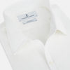 View 2 of product The Turnbull & Asser Plain White Windsor Shirt features a Turnbull open collar, 3-button cuffs, and relaxed fit—exemplifying British craftsmanship. Displayed on a white background.