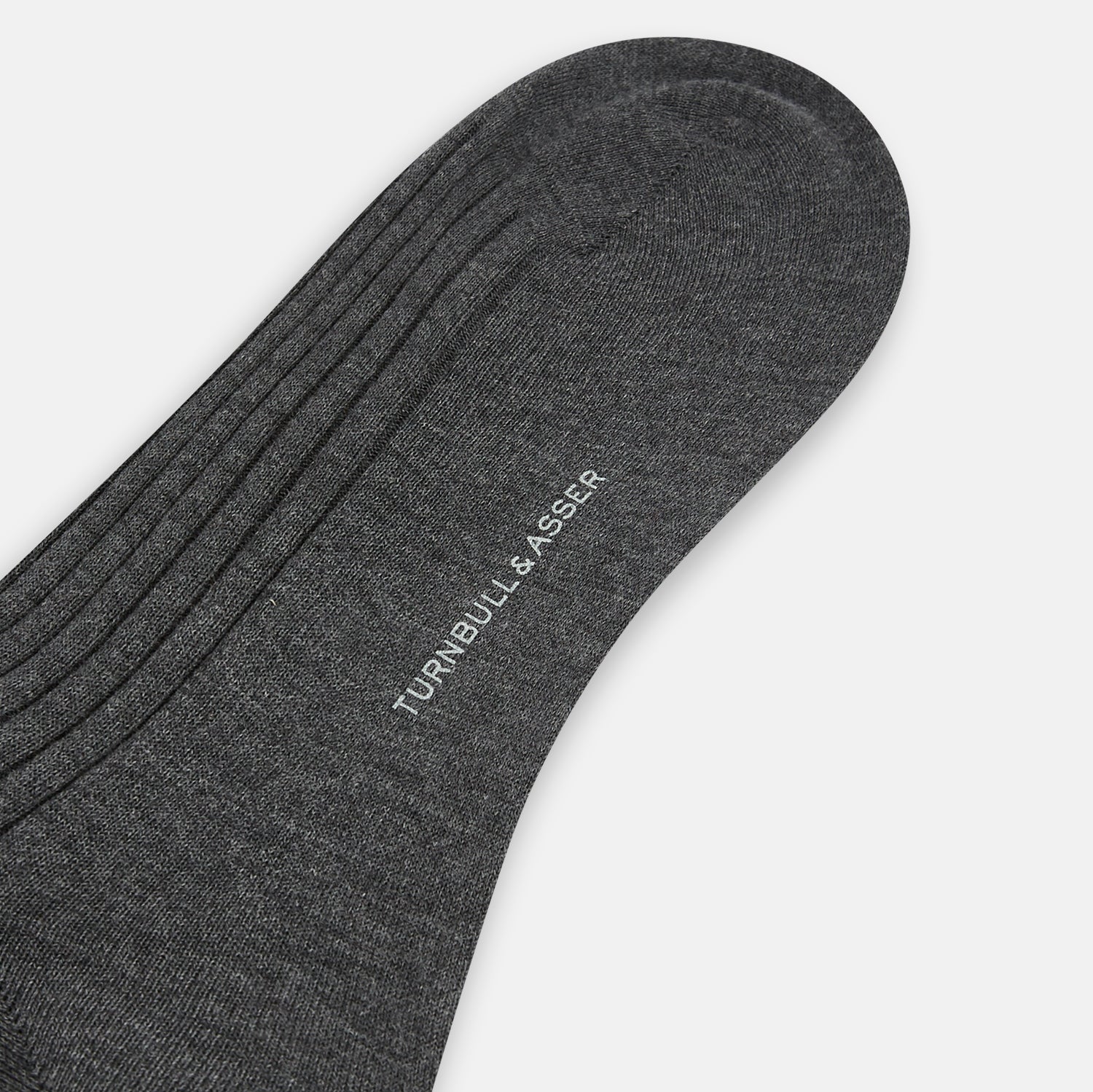 View 3 of product A single Grey Organic Cotton Mid-Length Sock by Turnbull & Asser is shown upright on a white background, featuring a ribbed texture and reinforced cuff.
