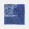 View 1 of product The Blue Maze Silk Pocket Square by Turnbull & Asser features a geometric maze-inspired pattern and central logo, with a folded corner for an artful touch.
