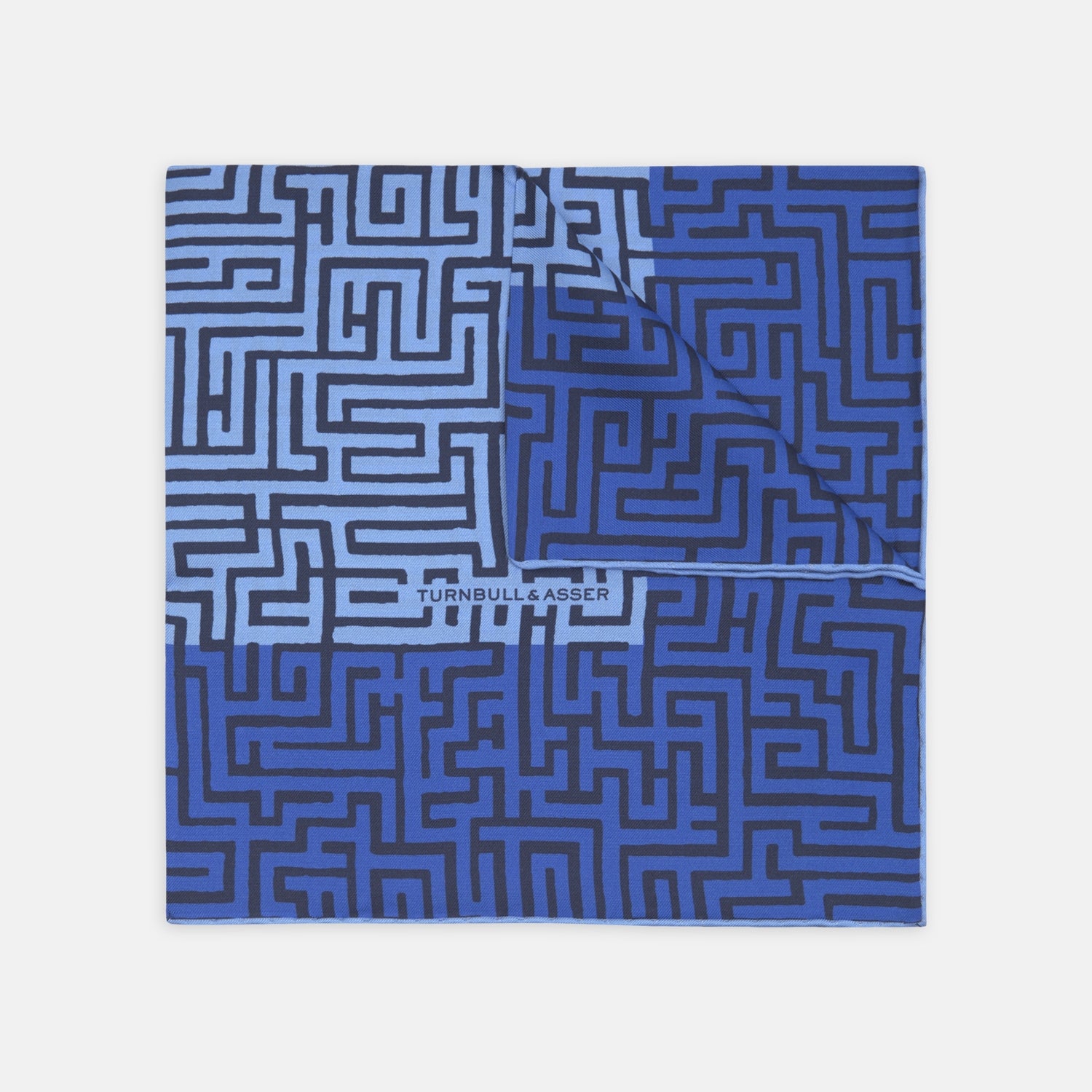 View 1 of product The Blue Maze Silk Pocket Square by Turnbull & Asser features a geometric maze-inspired pattern and central logo, with a folded corner for an artful touch.
