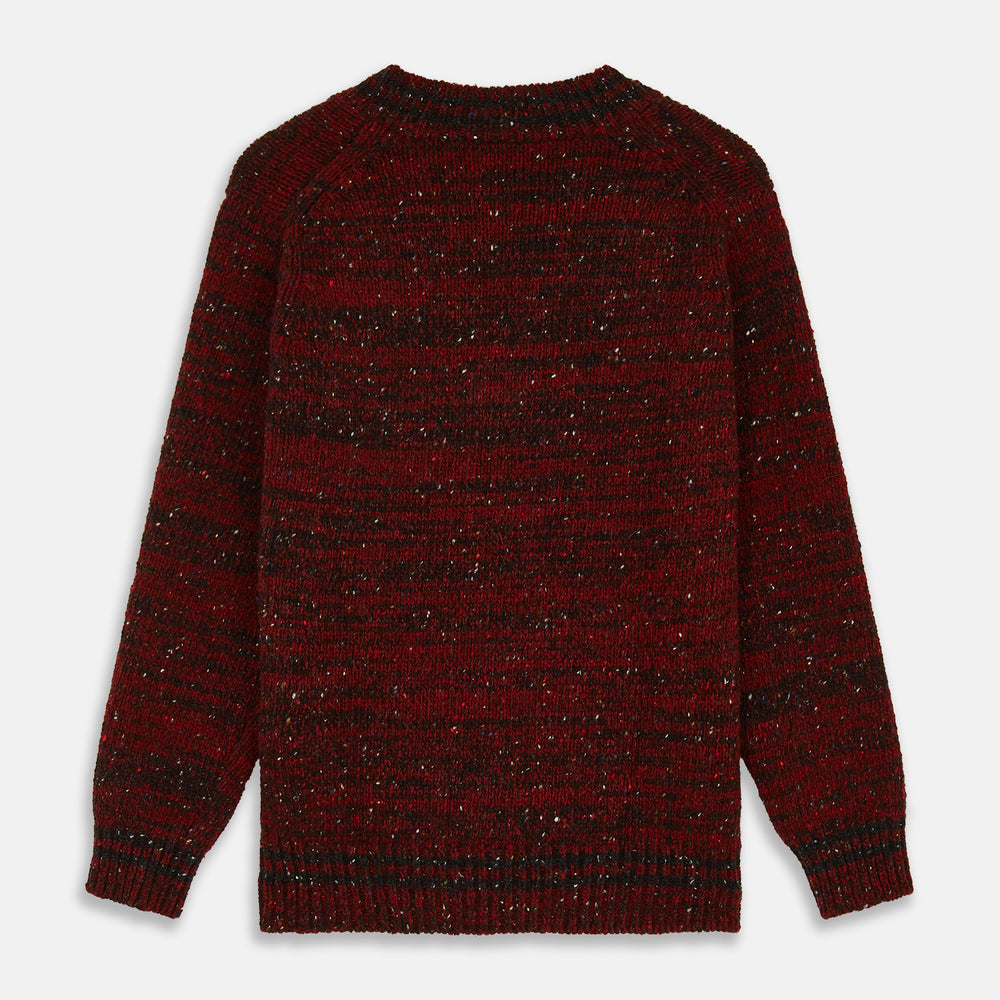 The Turnbull & Asser Russet Red Melange Wool Hafod Cricket Jumper features maroon and black speckles, a V-neck, long sleeves, and ribbed cuffs and hem, displayed flat on a white background.