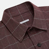View 2 of product The Turnbull & Asser Burgundy Check Hampstead Overshirt, featuring a button-up front, collar, white windowpane pattern, and two front pockets, is laid flat on a white background—perfect for elegant formal wear.