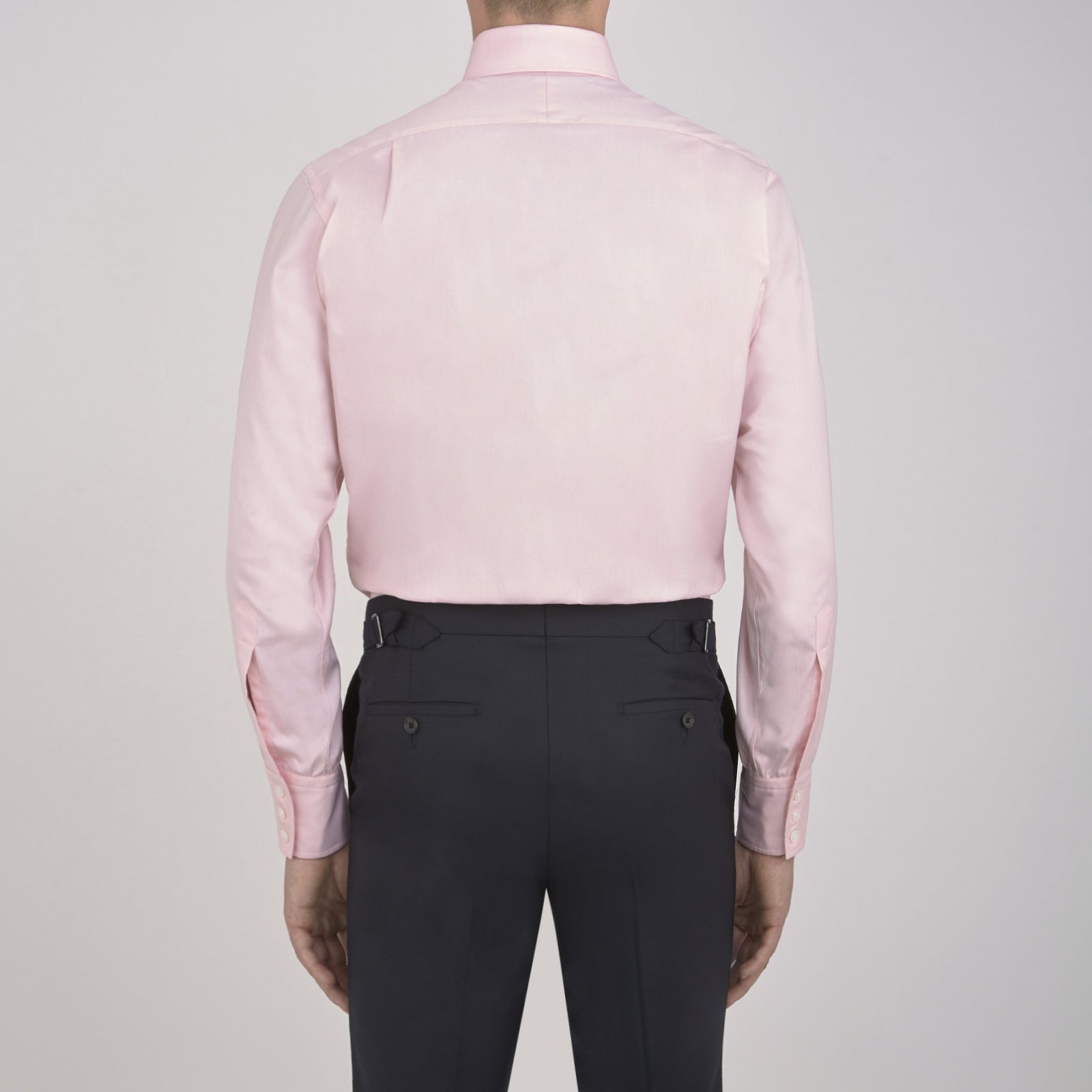 View 6 of product The Turnbull & Asser Pink Royal Oxford Cotton Shirt features a button-down collar and 3-button cuffs, ideal for men's weekend wear. Displayed against a plain white background.