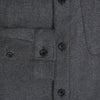 View 4 of product The Grey Highbury Overshirt by Turnbull & Asser is a long-sleeve, button-up charcoal gray overshirt with a single chest pocket, inspired by classic formal jackets and shown laid flat on a white background.