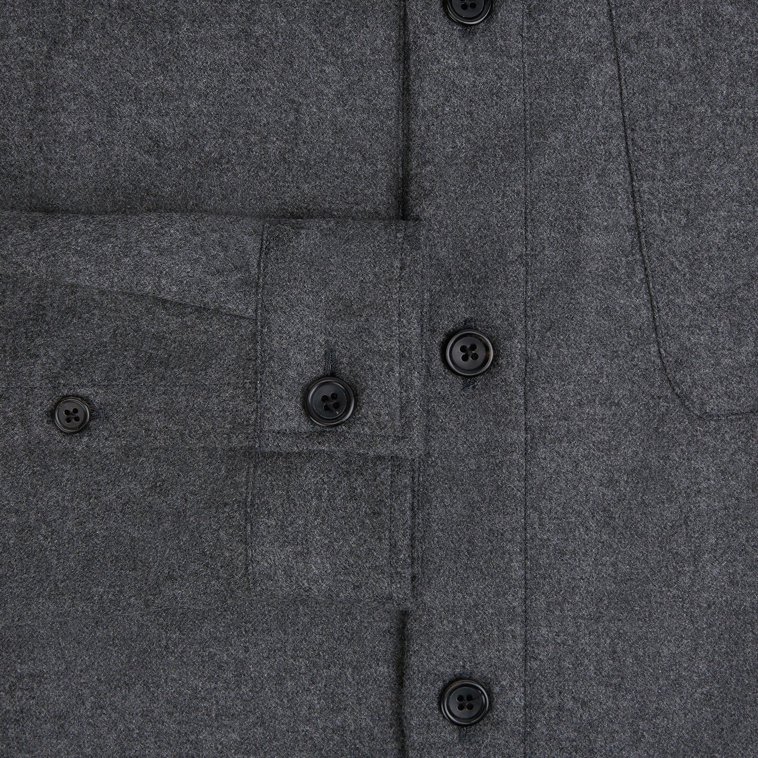 View 4 of product The Grey Highbury Overshirt by Turnbull & Asser is a long-sleeve, button-up charcoal gray overshirt with a single chest pocket, inspired by classic formal jackets and shown laid flat on a white background.