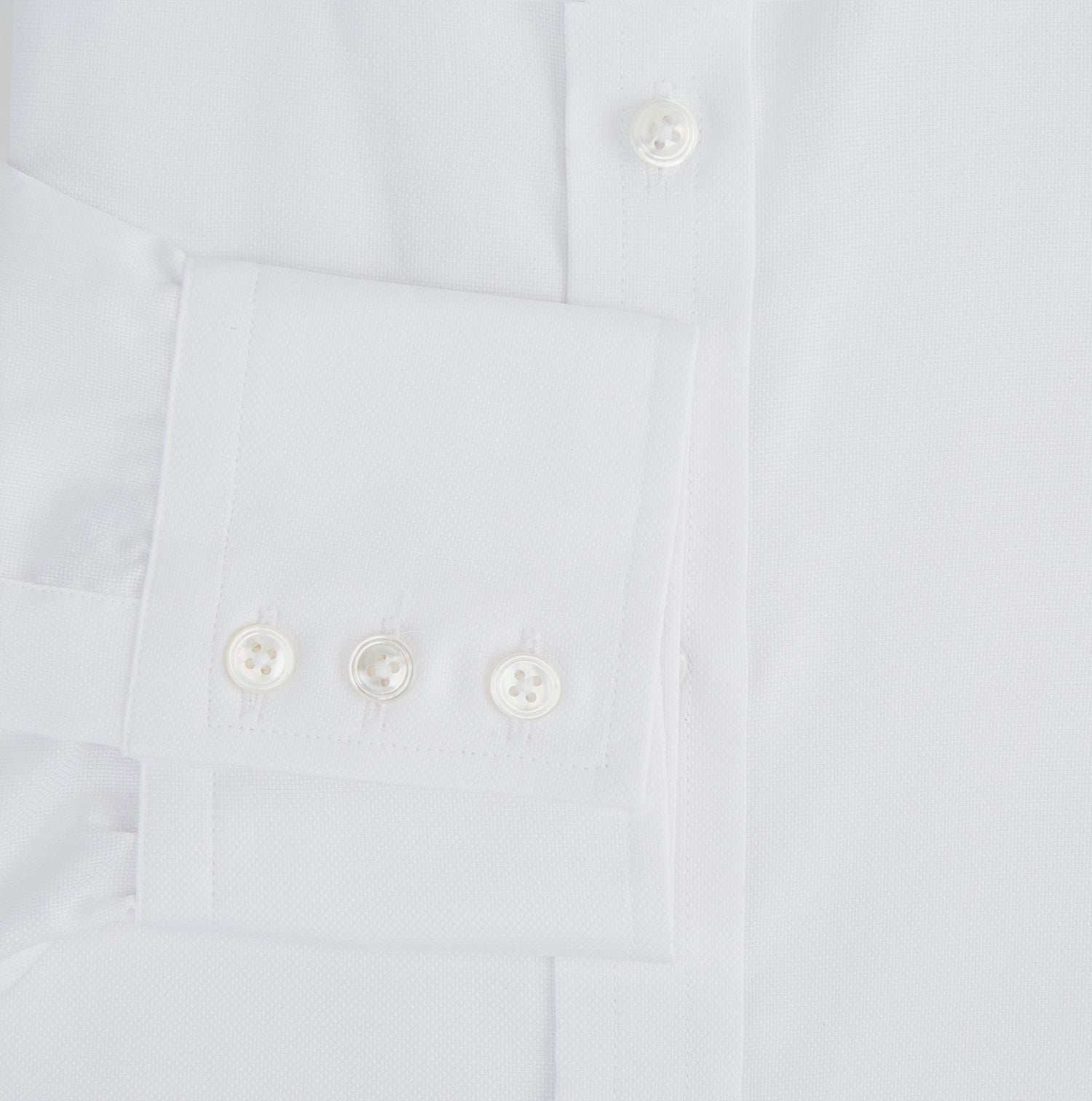 View 3 of product The Turnbull & Asser White Superfine Oxford Cotton Shirt features a T&A collar and 3-button cuffs—ideal for elegant evening attire, shown against a white background.
