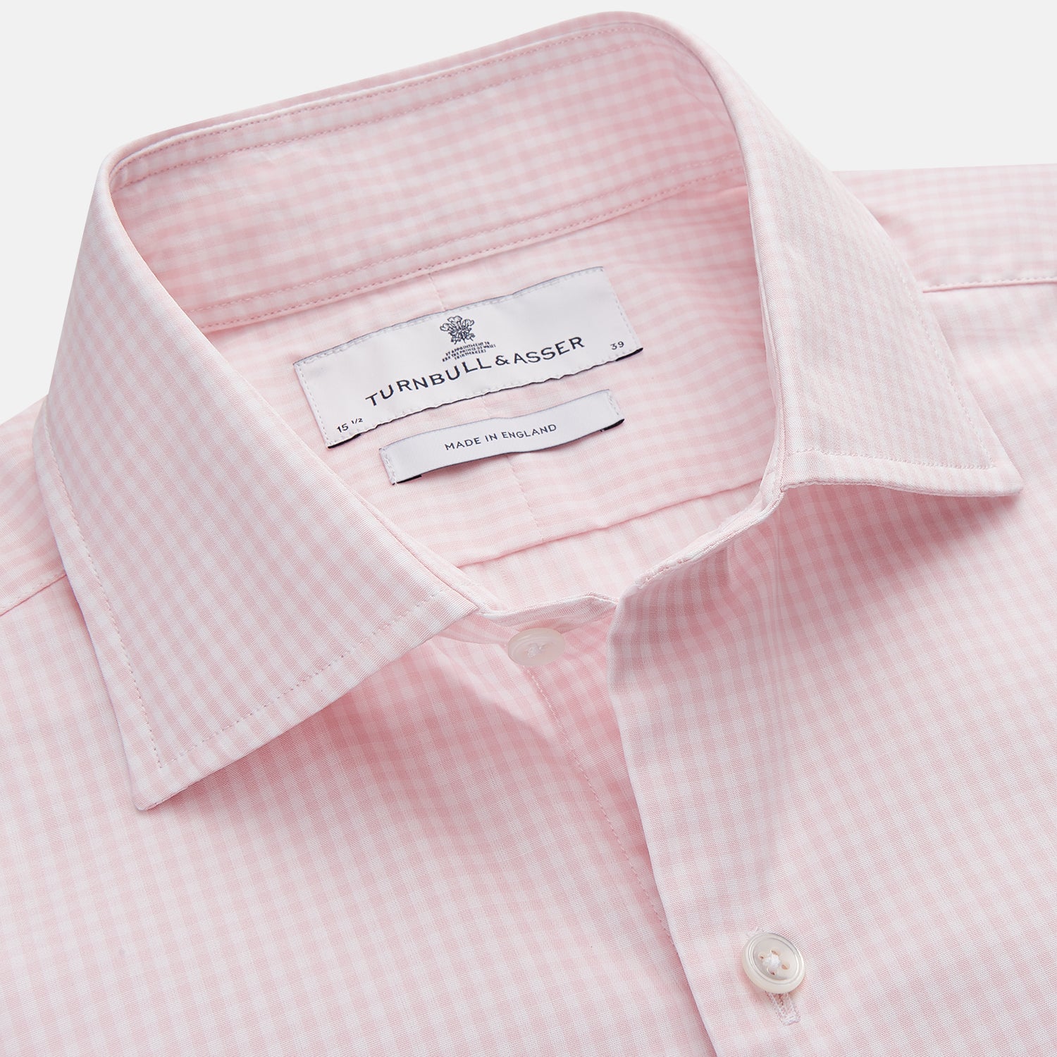 View 2 of product The Turnbull & Asser Pink Windowpane Check Shirt features long sleeves, a button-down front, pointed collar, and buttoned cuffs—an elegant addition to any formal shirt collection.