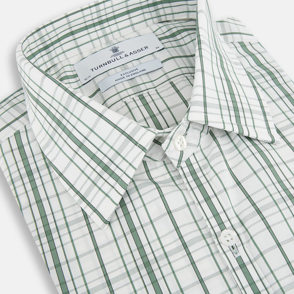 The Turnbull & Asser Sage Green Plaid Check Westminster Shirt features a collared, long-sleeve button-up design with a white base and sage green plaid pattern, showcasing classic British craftsmanship against a clean white background.